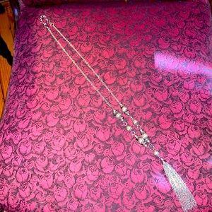 New silver long necklace with tassel.